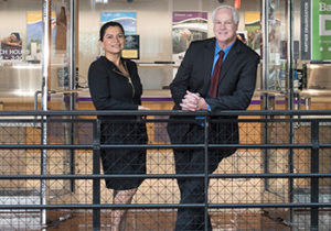 Carla Decker and Thomas Culhane standing together in an office setting