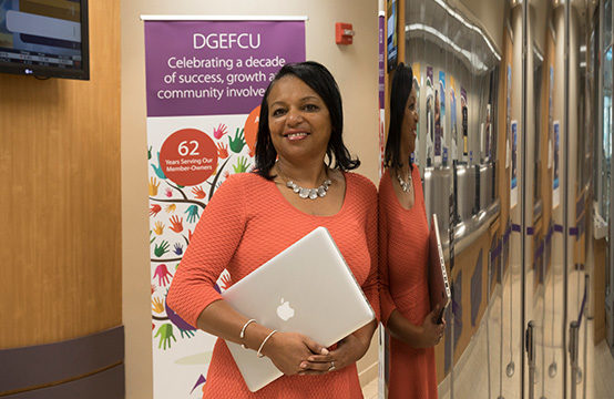 Antoinetter standing in a DC Credit Union branch