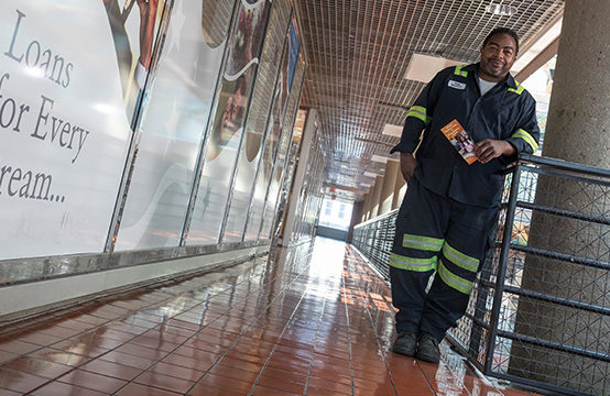 Woman firefighter standing in the hallway outside of DC Credit Union